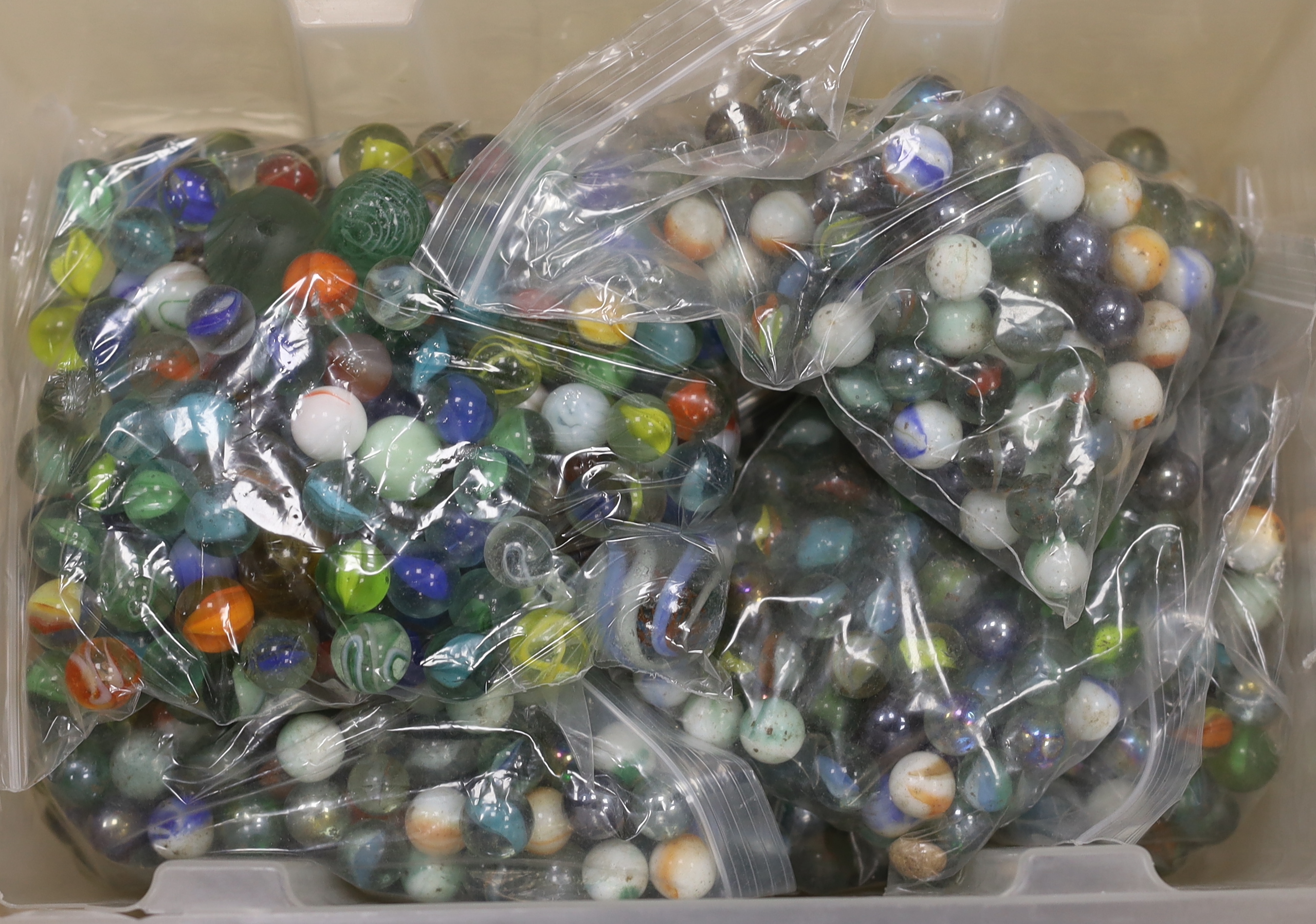 A large collection of glass marbles in two boxes